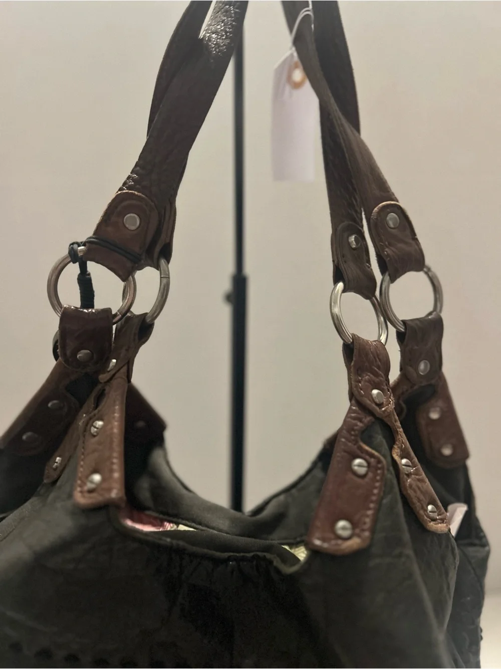 The Sak Black Leather Hobo Bag with Brown Trim